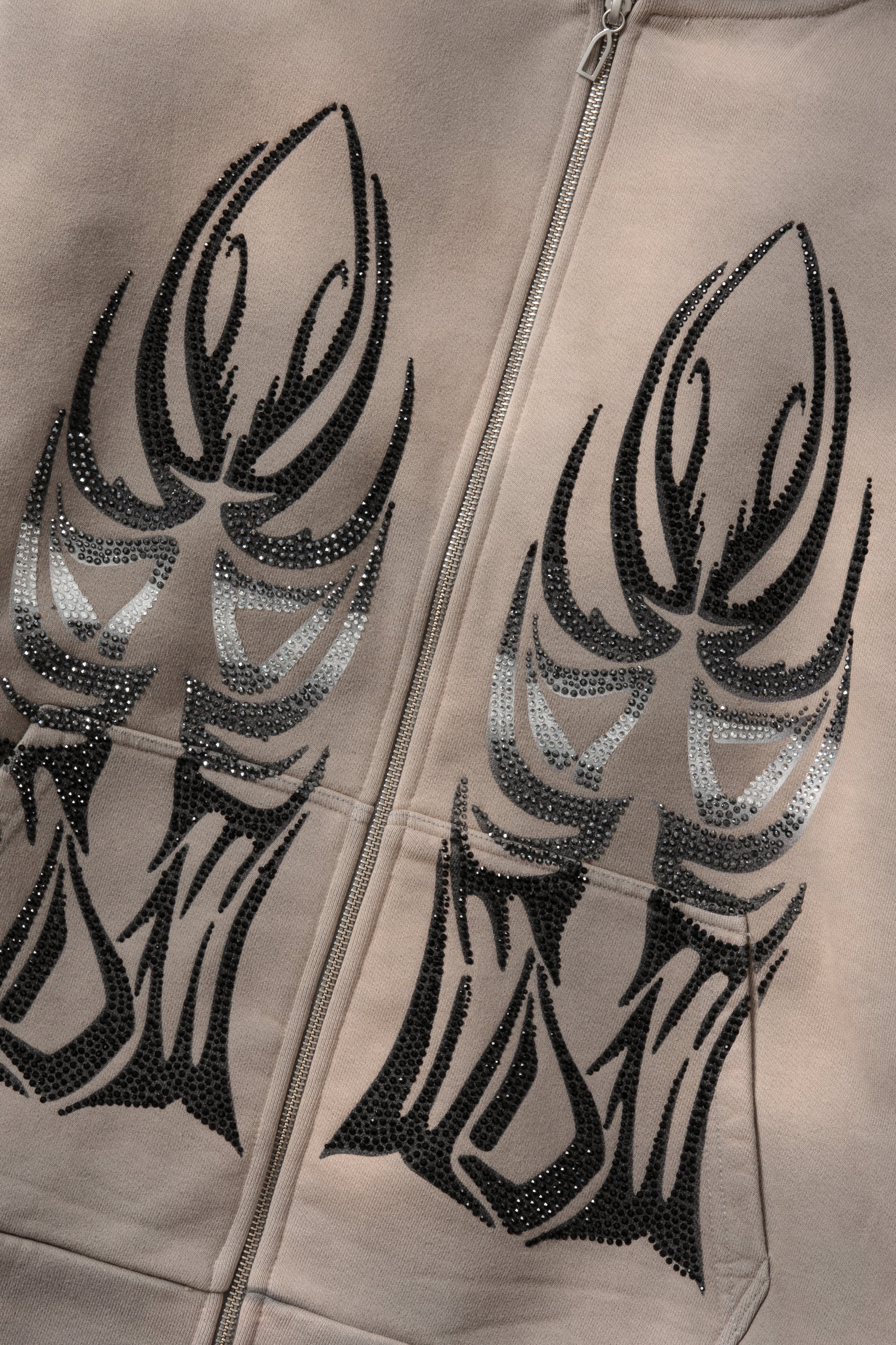 WINGED ZIP UP